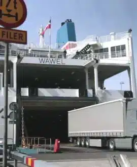 A truck drives off the Wawel ferry.